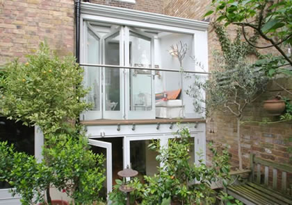 Double Storey Conservatory with Folding Sliding Doors in Holland Park, London