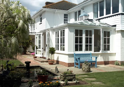 Conservatory on traditional weatherboard house in Sussex