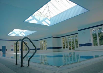 Pool cover over large pool in private school in Surrey
