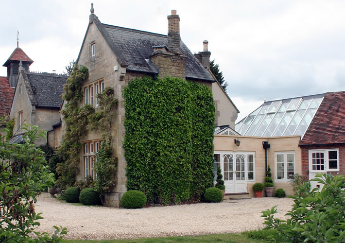 Elegant Malbrook conservatory with glass roof extension