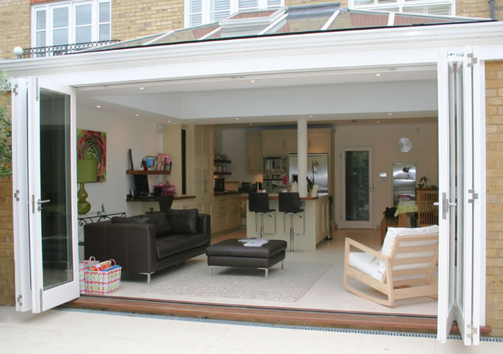 Open timber folding doors revealing luxurious interior